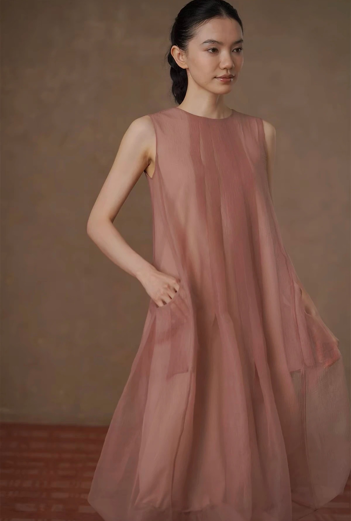 Three-quarter view of the Solene Dress showing the sheer crinkled gauze over the lining.