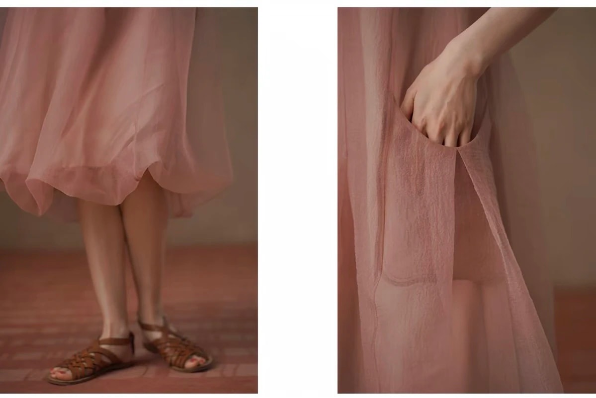 Details of the Solene Dress: the gathered hem above brown sandals, and a hand in the side pocket.