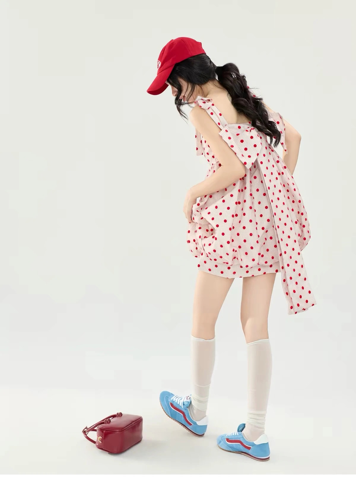 Back view of the Josette Dress showing the big polka dot bow with long tails.